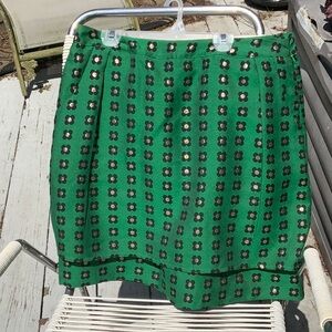 Green skirt with black and gold flowers